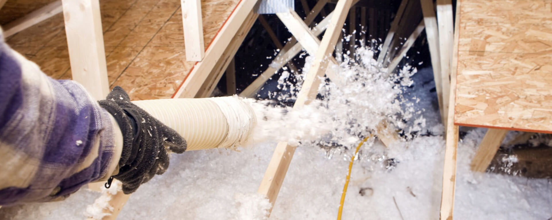 installer holding tube for blown in insulation