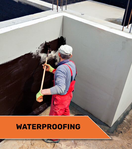 person installing foundational waterproofing